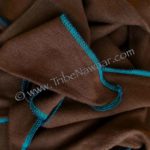Chocolate gaia fabric with aquamarine accent stitching from Tribe Nawaar.