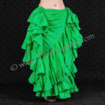 Tribe Nawaar's 25 Yard Emerald Cupcake Skirt, shown in a 'double cross' skirt tuck