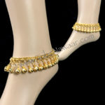 Tribe Nawaar's gold belled anklets. Great for belly dance, festivals and so much more! Image of anklets modeled.