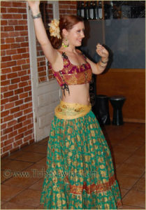 Anna of Tribe Nawaar Dance Company wearing a corseted bodice & sitara skirt