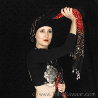 How to wrap a turban, twist the accent fabric with the base fabric (www.TribeNawaar.com)