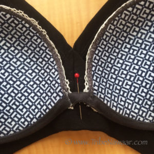 Tribe Nawaar's how to adjust the fit on your tribal belly dance choli top: pinning a bra to the choli top's center seam