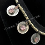 Detail of coin necklace with pale pink accents from Tribe Nawaar