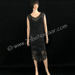 1920s black beaded & sequined tabard panel dress available thru Tribe Nawaar, shown with a black slip