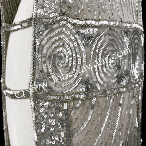 1920s silver beaded & sequined tabard panel dress available thru Tribe Nawaar, shown with a black slip
