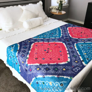 Blue & pink embellished bandhini wrap from The Nawaar Marketplace at www.TribeNawaar.com shown in home decor